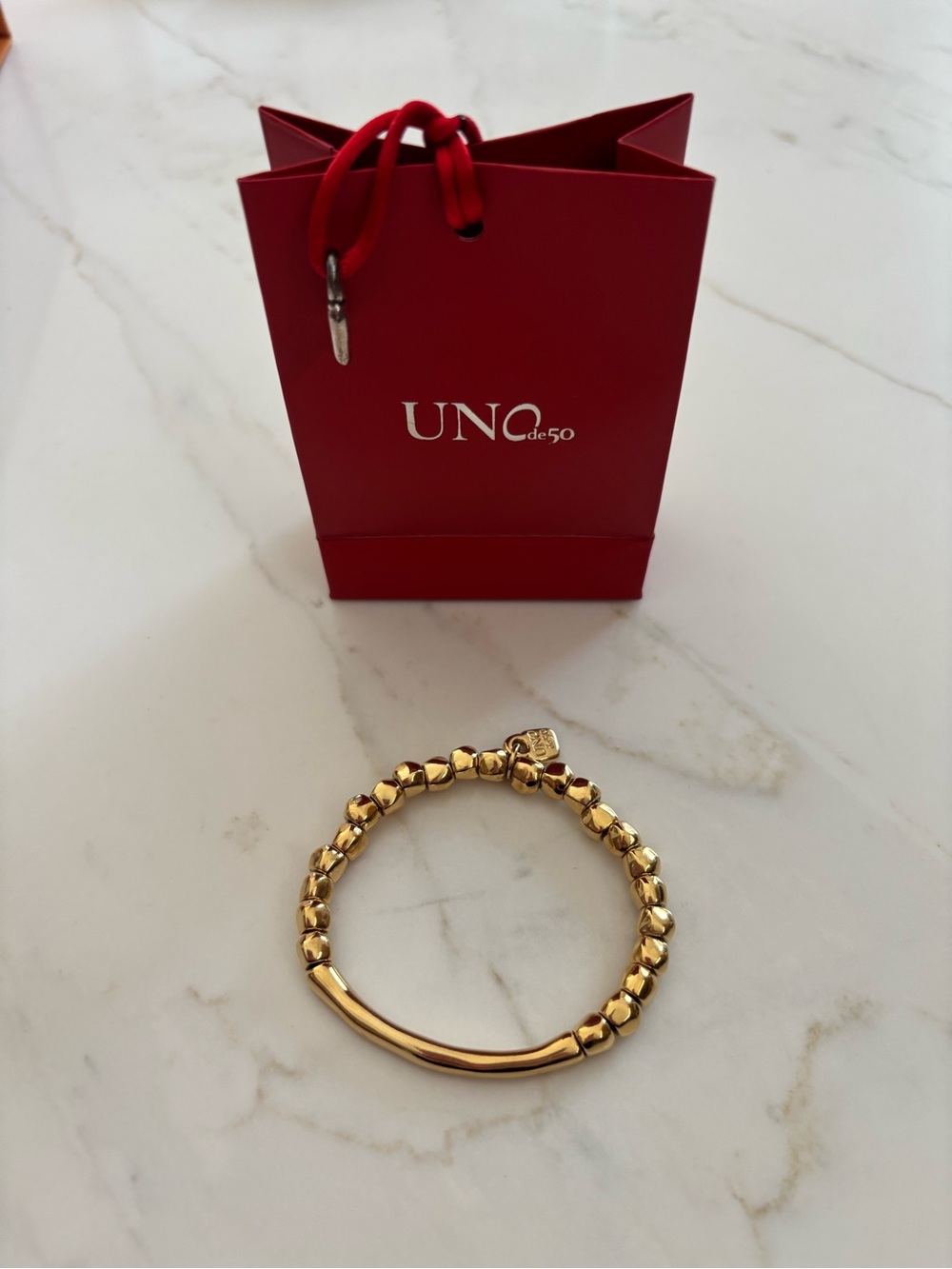 UNO de 50 Gold Bead Bracelet with Curved Bar